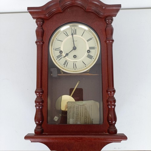 811 - A mantel clock, in a mahogany case, another, a wall clock, a barometer, a top hat, boxed, and assort... 