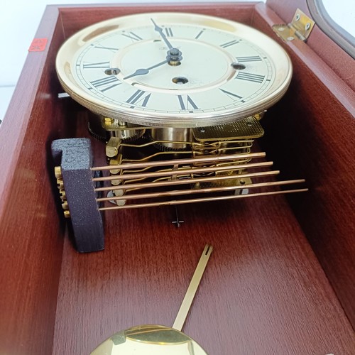 811 - A mantel clock, in a mahogany case, another, a wall clock, a barometer, a top hat, boxed, and assort... 