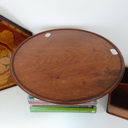 830 - A mahogany cutlery tray, 40 cm wide, a mahogany dumb waiter, 40 cm diameter, a hexagonal tray, and a... 