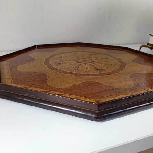 830 - A mahogany cutlery tray, 40 cm wide, a mahogany dumb waiter, 40 cm diameter, a hexagonal tray, and a... 