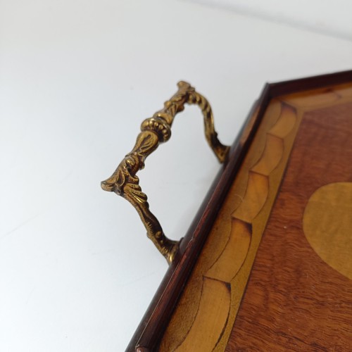 830 - A mahogany cutlery tray, 40 cm wide, a mahogany dumb waiter, 40 cm diameter, a hexagonal tray, and a... 