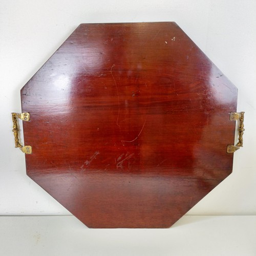 830 - A mahogany cutlery tray, 40 cm wide, a mahogany dumb waiter, 40 cm diameter, a hexagonal tray, and a... 