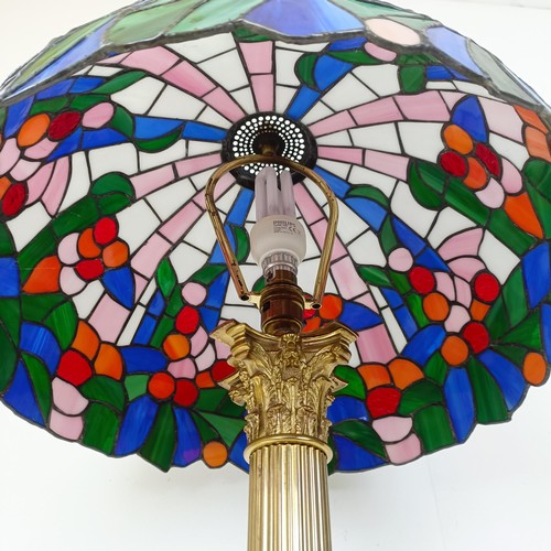 831 - A Tiffany style lamp, on a brass base, in the form of a Corinthian column, 73 cm high