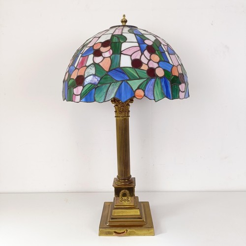 831 - A Tiffany style lamp, on a brass base, in the form of a Corinthian column, 73 cm high