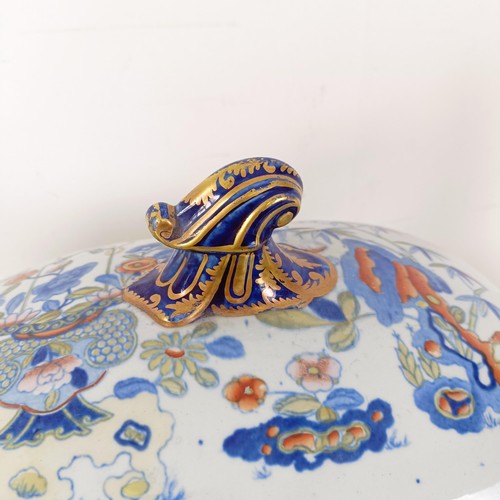 832 - A Masons ironstone tureen and cover, on a stand with a ladle, 43 cm wide, and a lamp base, decorated... 