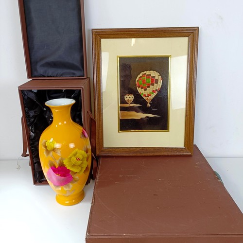 838 - A Japanese yellow vase decorated with flowers, boxed, and a straw picture of hot air balloons, cased... 