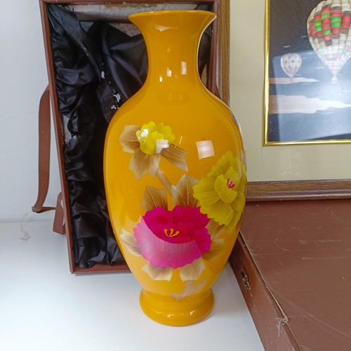 838 - A Japanese yellow vase decorated with flowers, boxed, and a straw picture of hot air balloons, cased... 