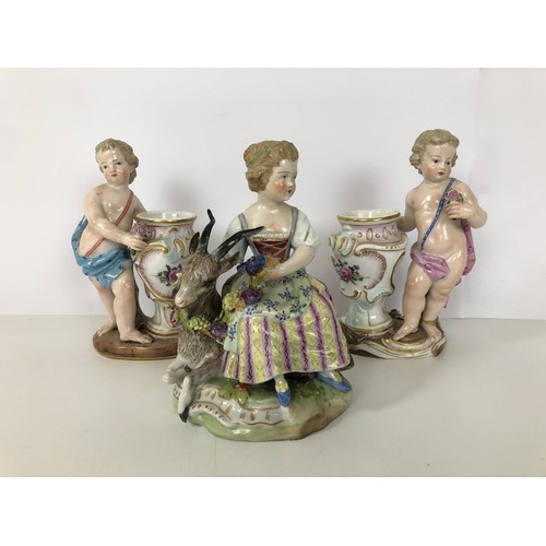 876 - A Dresden group, of a girl with a goat, 15 cm high, and a pair of Dresden figural salts (3)