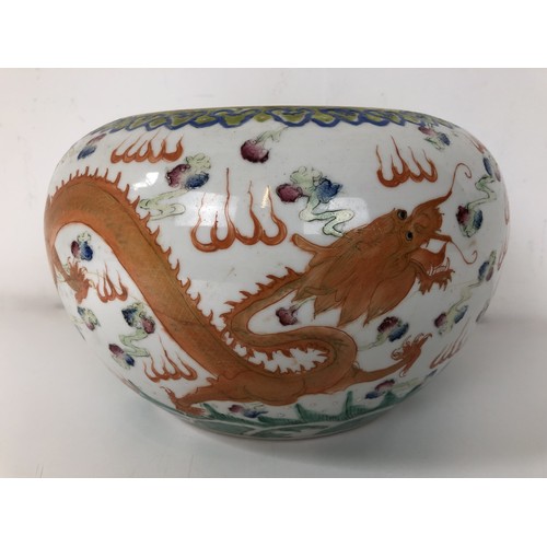 874 - A Chinese porcelain bowl, decorated dragon, bird and flaming pearl, six character mark to base, 26 c... 