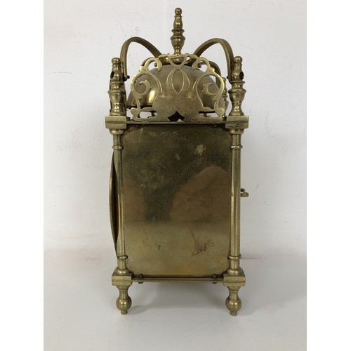 873 - A lantern clock, in a brass case, 20 cm high