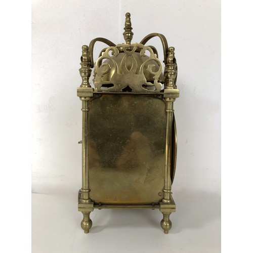 873 - A lantern clock, in a brass case, 20 cm high