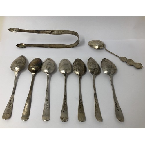 867 - A pair of sugar nips, assorted spoons and a sterling silver page marker, various dates and marks 4.1... 