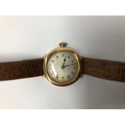 866 - A yellow coloured metal ladies wristwatch, on a leather strap, another, and assorted costume jewelle... 