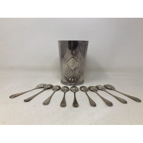 865 - A silver coloured metal mug, and assorted silver and silver plated teaspoons