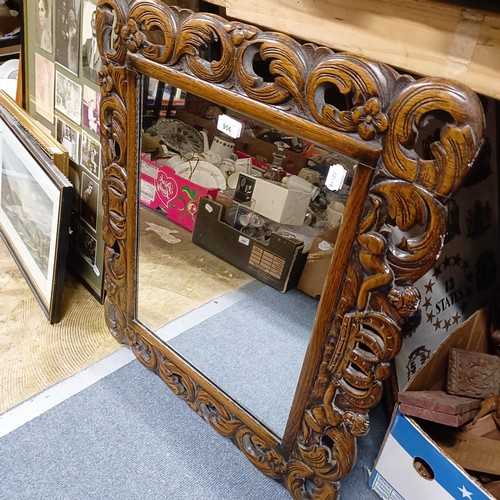 906 - An oak framed wall mirror, assorted prints, pictures and mirrors (qty)