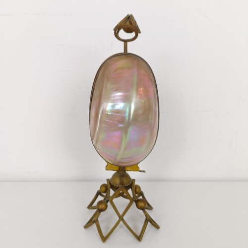 913 - A mother of pearl and gilt metal novelty perfume bottle holder, 27 cm high