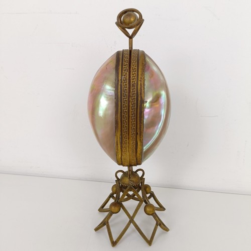 913 - A mother of pearl and gilt metal novelty perfume bottle holder, 27 cm high