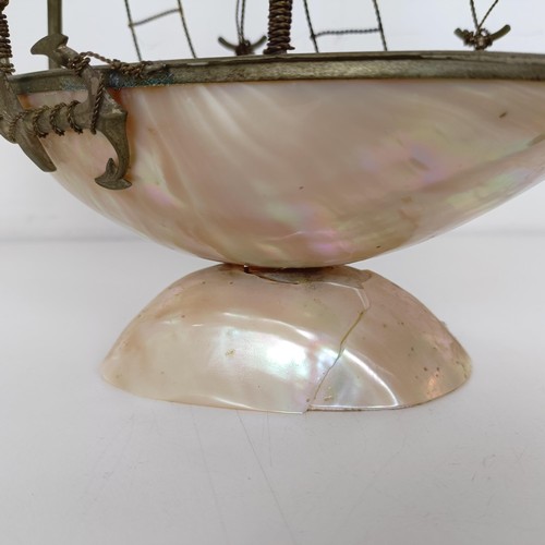 914 - A novelty mother of pearl model of a ship, 39 cm high