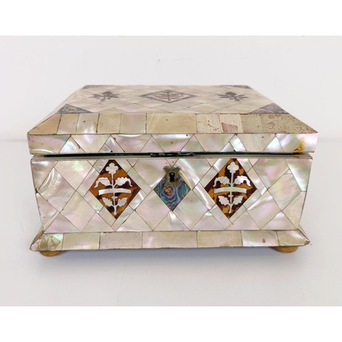 915 - A mother of pearl veneered jewellery box, 23 cm wide