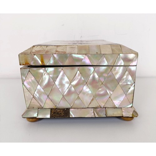 915 - A mother of pearl veneered jewellery box, 23 cm wide