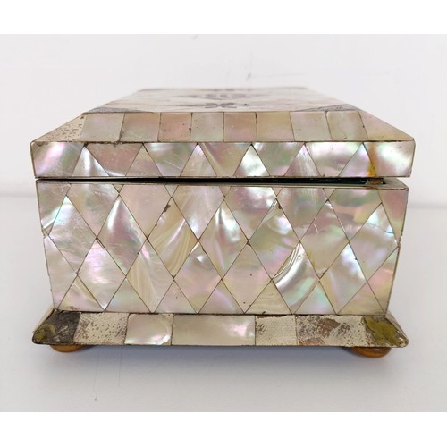 915 - A mother of pearl veneered jewellery box, 23 cm wide