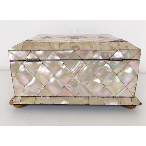 915 - A mother of pearl veneered jewellery box, 23 cm wide