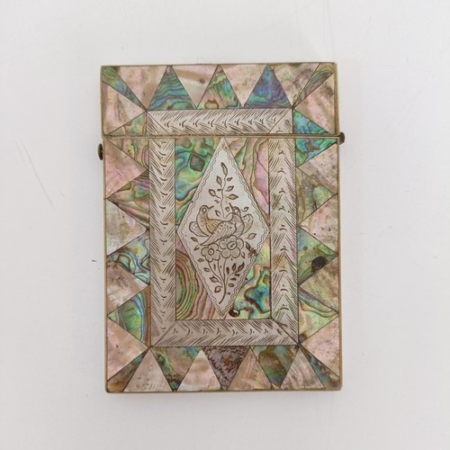 916 - A mother of pearl card case, 10 cm wide, two carved mother of pearl plaques, and other mother of pea... 