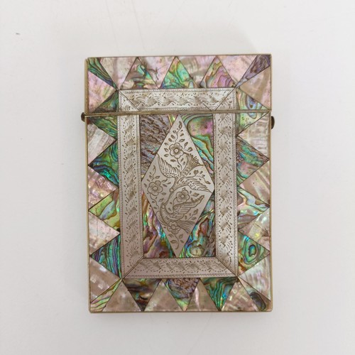 916 - A mother of pearl card case, 10 cm wide, two carved mother of pearl plaques, and other mother of pea... 