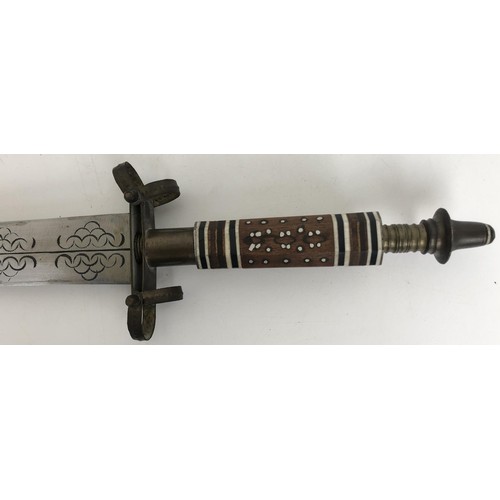 528 - An African Takouba style sword, the wooden handle inlaid with bone, in a leather mounted scabbard, f... 