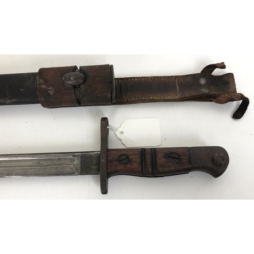 531 - A Remington bayonet, numbered 1913 5 16, in a scabbard with a hangar