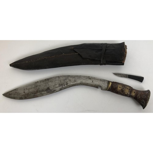 533 - A Jambiya, in a silver coloured metal mounted scabbard, and a kukri, in a leather scabbard (2)