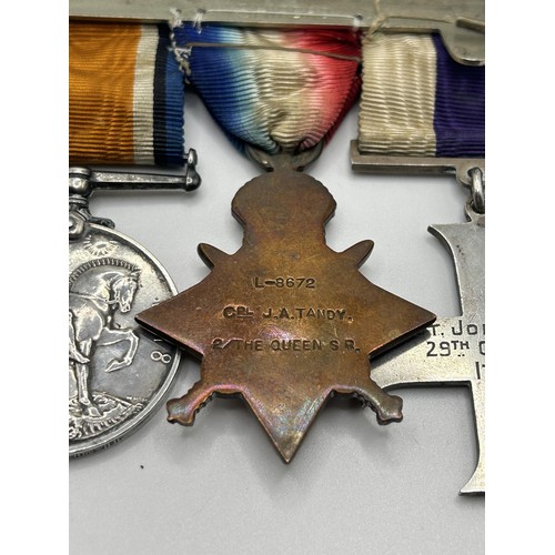 538 - A group of four medals, awarded to Lt John A Tandy, comprising a Military Cross, privately named and... 