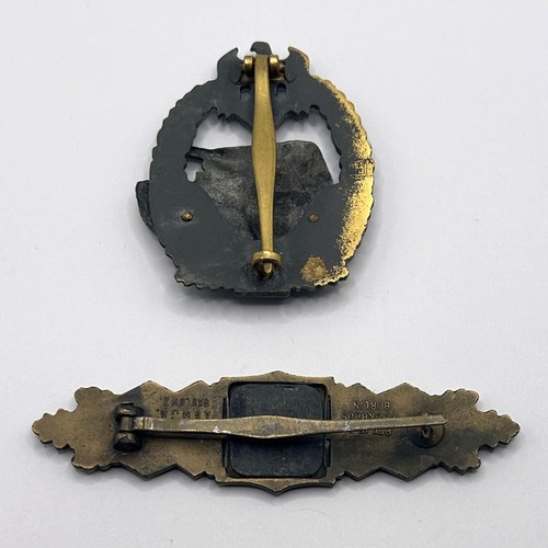 553 - A German Third Reich tank badge, and another badge