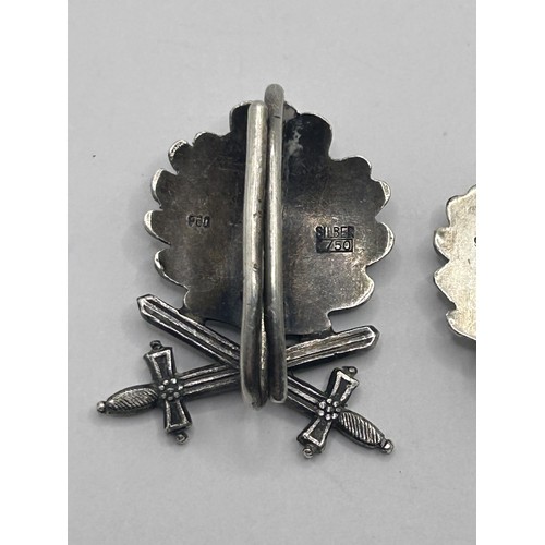 558 - A German Third Reich Narvik 1940 badge, an Oakleaf badge and an Oakleaf and Swords badge