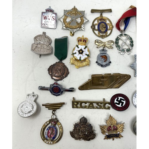 575 - Assorted military and other badges and brooches, including ARP