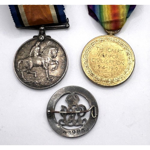 581 - A British War Medal and Victory Medal pair, awarded to 41440 Pte T Gardner Manch R, with a silver wo... 