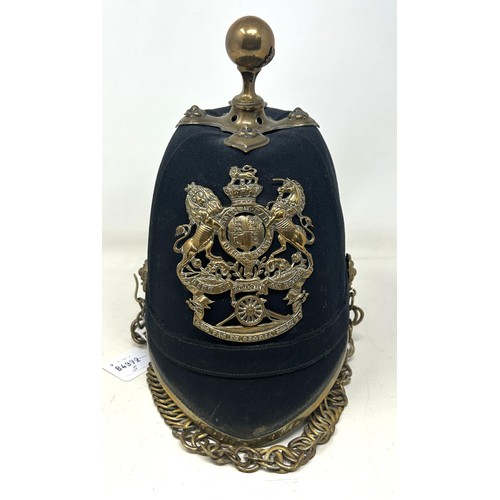 586 - A late Victorian Royal Artillery cloth helmet, with a ball finial and chin strap