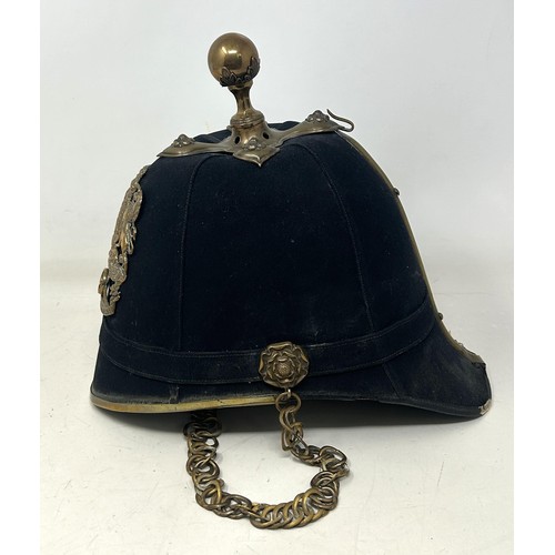 586 - A late Victorian Royal Artillery cloth helmet, with a ball finial and chin strap