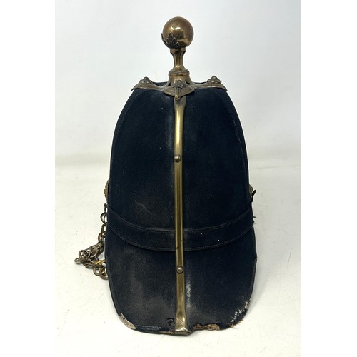 586 - A late Victorian Royal Artillery cloth helmet, with a ball finial and chin strap