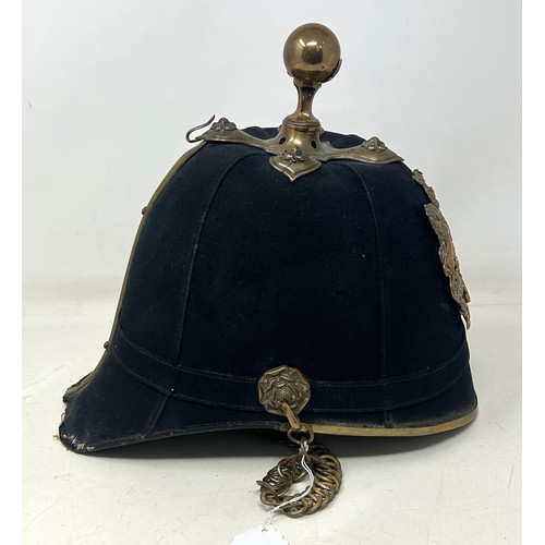 586 - A late Victorian Royal Artillery cloth helmet, with a ball finial and chin strap