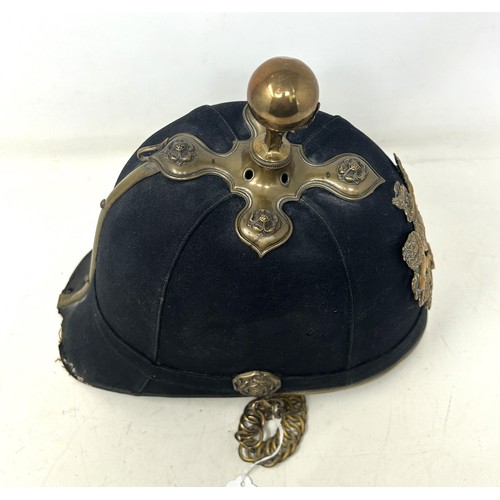 586 - A late Victorian Royal Artillery cloth helmet, with a ball finial and chin strap