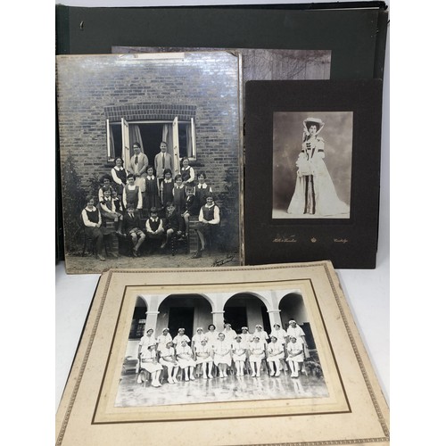 598 - An early 20th century photograph album, including formal military groups, sporting images and others