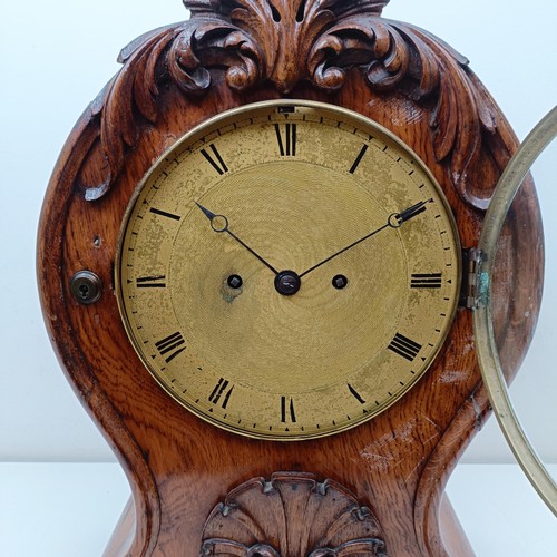 976 - A Victorian mantel clock, the brass dial with Roman numerals, fitted an eight day double fusee movem... 