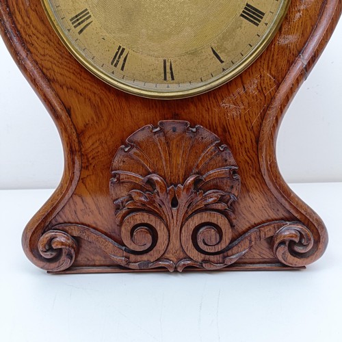 976 - A Victorian mantel clock, the brass dial with Roman numerals, fitted an eight day double fusee movem... 