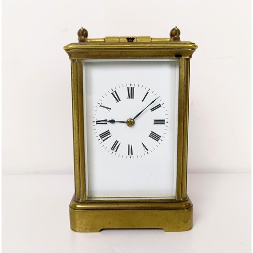 971 - A carriage clock, with repeat, in a brass and glass case, 18 cm high