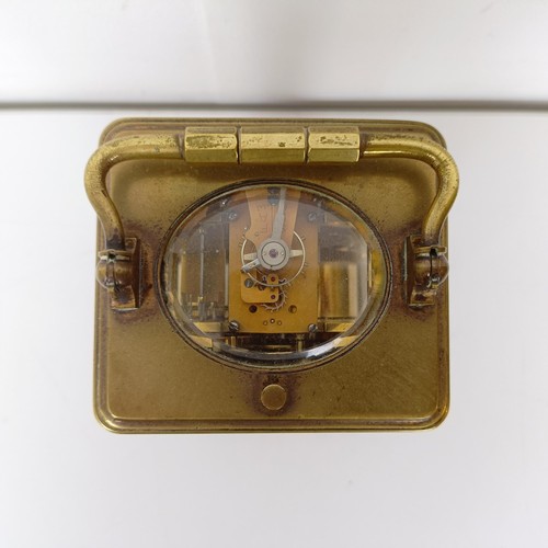 971 - A carriage clock, with repeat, in a brass and glass case, 18 cm high