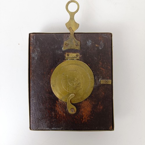 973 - A sedan chair clock, in an ebonised and metal case, fitted a later movement, 20 x 13 cm