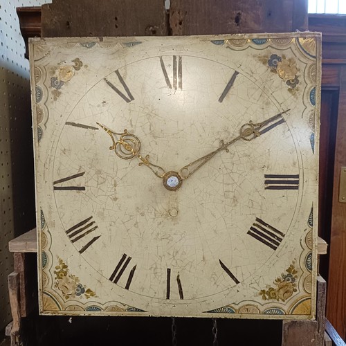 977 - A longcase clock, with a painted dial, fitted a thirty hour movement, in a pine case, 193 cm high