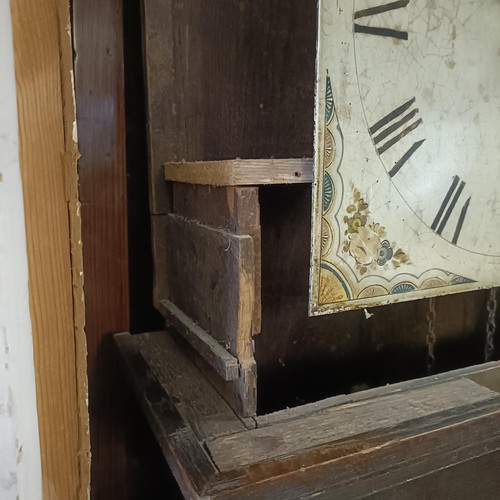 977 - A longcase clock, with a painted dial, fitted a thirty hour movement, in a pine case, 193 cm high