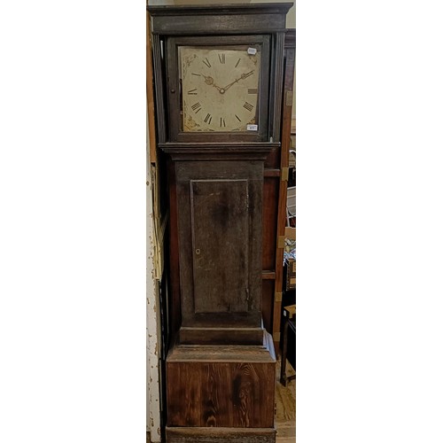 977 - A longcase clock, with a painted dial, fitted a thirty hour movement, in a pine case, 193 cm high